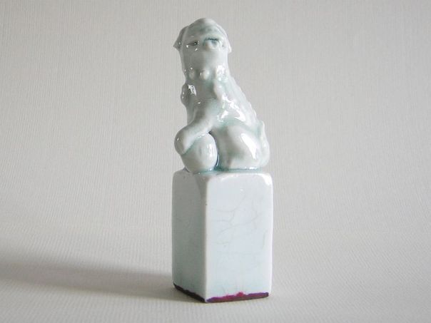 Porcelain Fu dog with brocade ball - (5467)